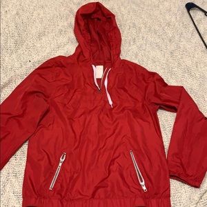 Red wind breaker jacket.